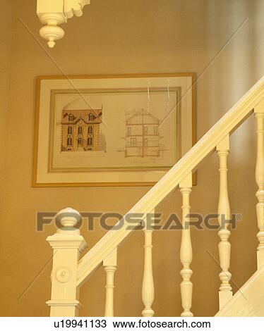 Close-up of white wooden bannisters with framed architectural drawing on back wall View Large Photo Image Stock Image - Close-up of white wooden bannisters with framed architectural drawing on back wall. Fotosearch