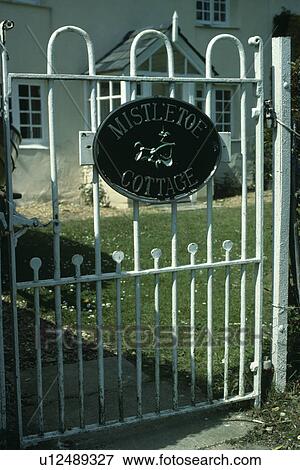 Close up of white wrought iron garden gate View Large Photo Image Stock Photo - Close up of white wrought iron garden gate. Fotosearch