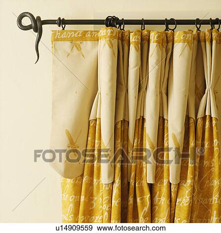 Close-up of yellow curtains on rustic metal pole View Large Photo Image Stock Photo - Close-up of yellow curtains on rustic metal pole. Fotosearch