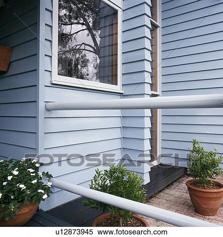 Closeup of cladding and railing outside modern house View Large Photo Image Stock Photography - Closeup of cladding and railing outside modern house. Fotosearch