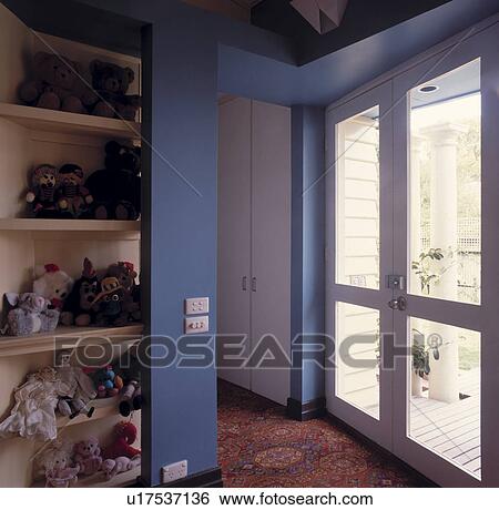 Collection of soft toys in modern blue hall with glass doors View Large Photo Image Stock Photograph - Collection of soft toys in modern blue hall with glass doors. Fotosearch
