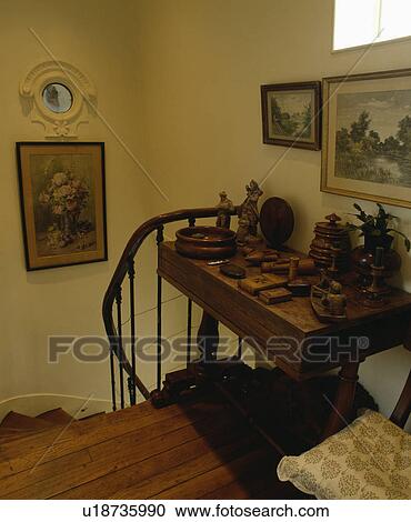 Collection of wooden boxes and ornaments on antique table on landing with wooden flooring View Large Photo Image Stock Image - Collection of wooden boxes and ornaments on antique table on landing with wooden flooring. Fotosearch