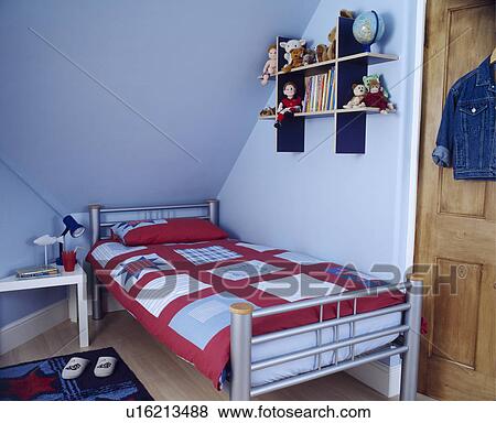 Contemporary blue child's bedroom under the eaves of an attic conversion View Large Photo Image Stock Photo - Contemporary blue child's bedroom under the eaves of an attic conversion. Fotosearch