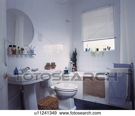 Contemporary white tiled bathroom View Large Photo Image Stock Photo - Contemporary white tiled bathroom . Fotosearch