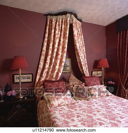 Coronet With Red White Drapes Above Bed With Mathcing Cushions And