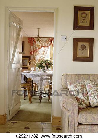Cottage living room with door open to diningroom View Large Photo Image Stock Image - Cottage living room with door open to diningroom . Fotosearch
