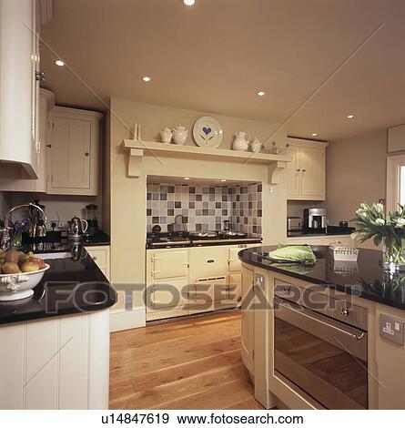 Stock Photograph Of Cream Aga Oven In Country Kitchen With Built Stock Photograph Cream Aga Oven In Country Kitchen With Built Island