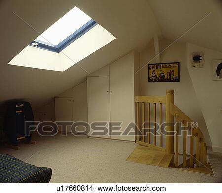 Cream carpet and Velux window in white attic bedroom withcream carpet View Large Photo Image Picture - Cream carpet and Velux window in white attic bedroom withcream carpet. Fotosearch