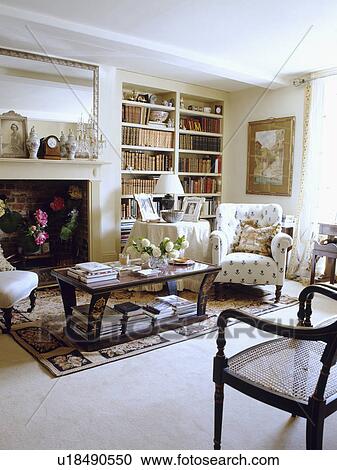 Stock Image - Cream carpet in traditional cream country living room. Fotosearch