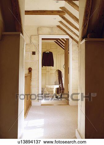 Cream carpet on landing with beamed ceiling and door open to bedroom View Large Photo Image Stock Photo - Cream carpet on landing with beamed ceiling and door open to bedroom . Fotosearch