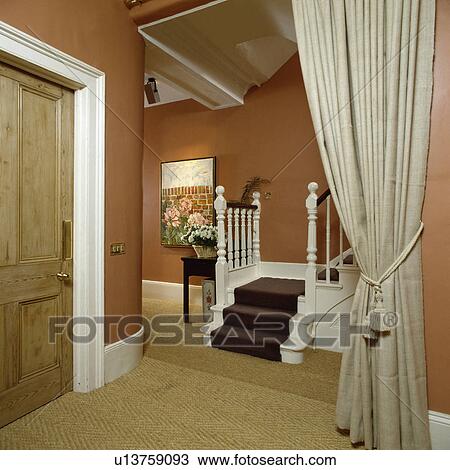 Cream linen curtain in terracotta hall with sisal carpet and brown stair carpet View Large Photo Image Stock Image - Cream linen curtain in terracotta hall with sisal carpet and brown stair carpet. Fotosearch