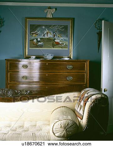 Cream silk Victorian chaiselongue and antique chest of drawers in grey living room View Large Photo Image Stock Image - Cream silk Victorian chaiselongue and antique chest of drawers in grey living room. Fotosearch