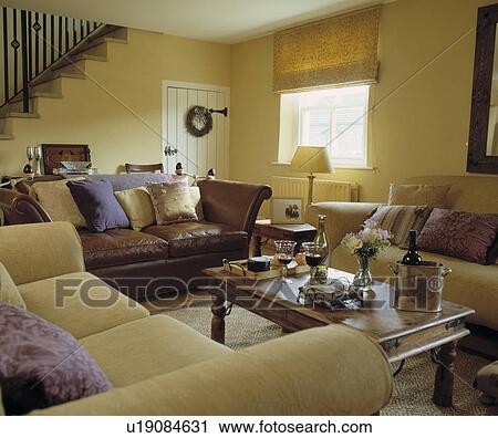 Stock Photography Of Cream Sofas And Yellow Blind In Pastel Cream Sofas And Yellow Blind In Pastel Cottage Living Room