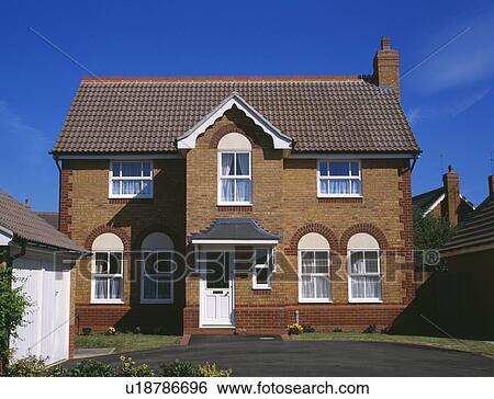 Stock Photograph - Detached newbuild traditional house . Fotosearch