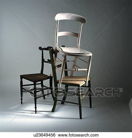 Detail A Pile Of Three Chairs Stock Photograph U23649456