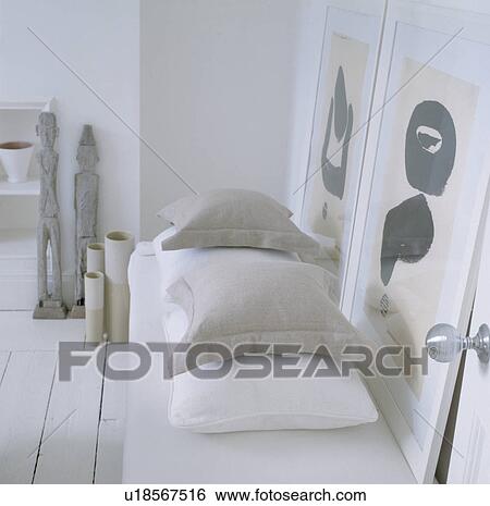 Detail of cushions on single bed in all white and grey room. View Large Photo Image Stock Photograph - Detail of cushions on single bed in all white and grey room.. Fotosearch