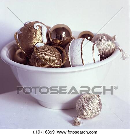 Detail of white bowl of gold and white Christmas baubles View Large Photo Image Stock Photo - Detail of white bowl of gold and white Christmas baubles. Fotosearch
