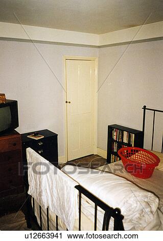 Stock Image - Dilapidated bedroom before renovation. Fotosearch
