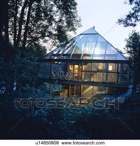 Stock Photo - Ecological glass house in the country. Fotosearch