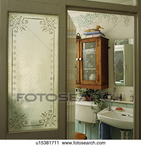 Engraved Glass Panel In Door Of Traditional Bathroom With Pine