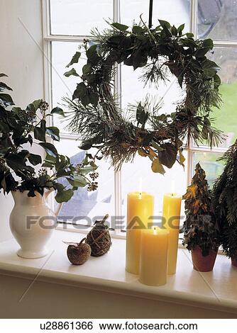 Evergreen Christmas Wreath And Candles On Windowsill Stock