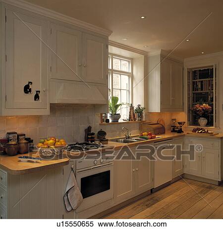 Stock Photography - Fitted Kitchen with Wooden Floorboards.. Fotosearch
