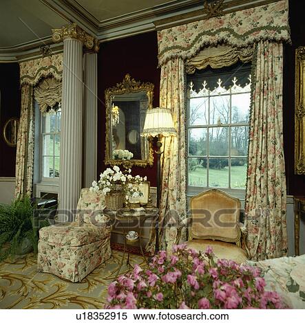 Floral pelmet and curtains in country drawing room View Large Photo Image Stock Photography - Floral pelmet and curtains in country drawing room. Fotosearch