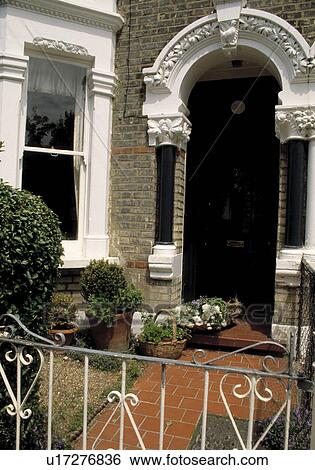 Stock Photograph - Front doors of traditional Victorian house. Fotosearch