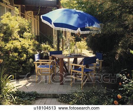 Furniture on patio in town garden in summer View Large Photo Image Stock Image - Furniture on patio in town garden in summer. Fotosearch