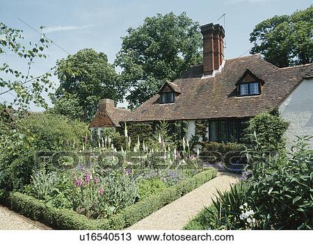 Gertrude Jekyll formal summer garden in front of country house designed by Edwin Lutyens View Large Photo Image Stock Image - Gertrude Jekyll formal summer garden in front of country house designed by Edwin Lutyens. Fotosearch