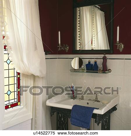 Glass shelf above white basin in black and white bathroom with white voile curtain at window View Large Photo Image Stock Photography - Glass shelf above white basin in black and white bathroom with white voile curtain at window. Fotosearch