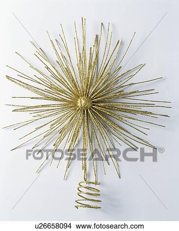 Gold starburst Christmas tree decoration View Large Photo Image Picture - Gold starburst Christmas tree decoration. Fotosearch