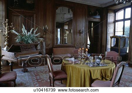 Green silk cloth on table in panelled French country dining room with grand piano View Large Photo Image Stock Photo - Green silk cloth on table in panelled French country dining room with grand piano. Fotosearch
