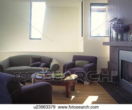 Stock Photo - Grey sofa and blue armchairs in modern whtie living room. Fotosearch