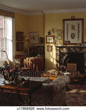 Group of pictures on wall in traditional living room View Large Photo Image Stock Photograph - Group of pictures on wall in traditional living room. Fotosearch