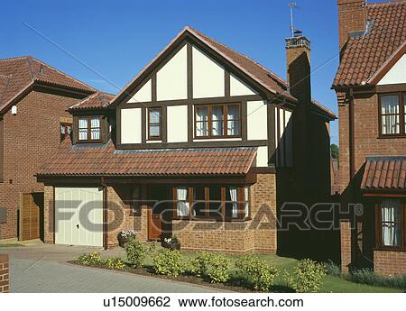 Stock Image - Half timbered newbuild house on small housing estate. Fotosearch