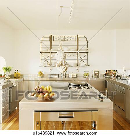 Hob built into island unit in modern kitchen woith stainless steel fitted cupboards View Large Photo Image Stock Image - Hob built into island unit in modern kitchen woith stainless steel fitted cupboards. Fotosearch