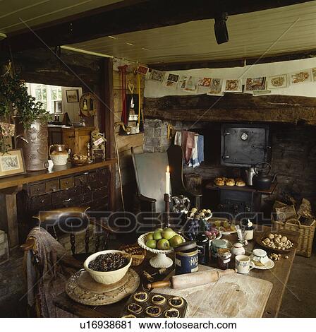 Ingredients and equipment for making mincepies on table in cottage kitchen with black stove View Large Photo Image Stock Image - Ingredients and equipment for making mincepies on table in cottage kitchen with black stove. Fotosearch