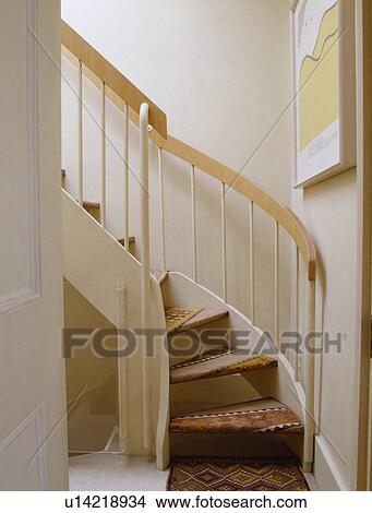 Picture - Kelim stair carpet on modern staircase on neutral landing. Fotosearch