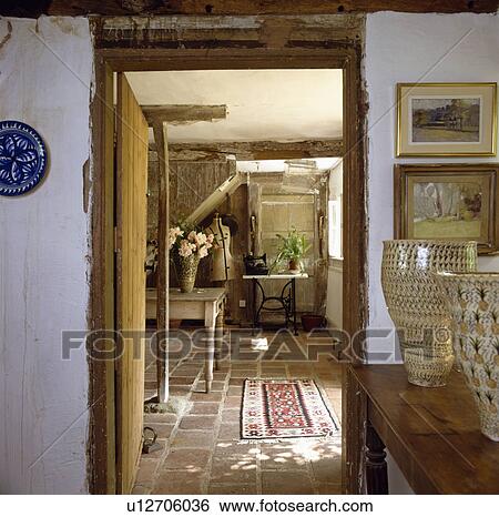 Large ceramic pots on table beside doorway with view of cottage dining room View Large Photo Image Stock Photograph - Large ceramic pots on table beside doorway with view of cottage dining room. Fotosearch