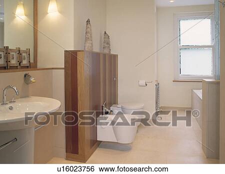 Stock Photograph - Large modern bathroom with white fittings.. Fotosearch