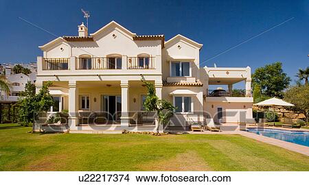 Picture - Large white Spanish villa with balcony over veranda. Fotosearch