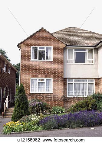 Lavender hedge in small garden in front of semi detached suburban house View Large Photo Image Stock Image - Lavender hedge in small garden in front of semi detached suburban house. Fotosearch
