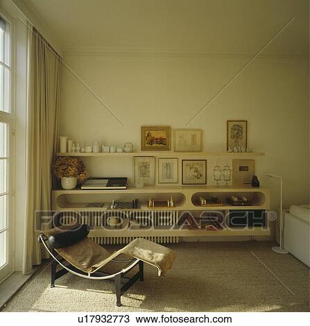 Le Corbusier chaiselongue in cream living room View Large Photo Image Stock Image - Le Corbusier chaiselongue in cream living room. Fotosearch