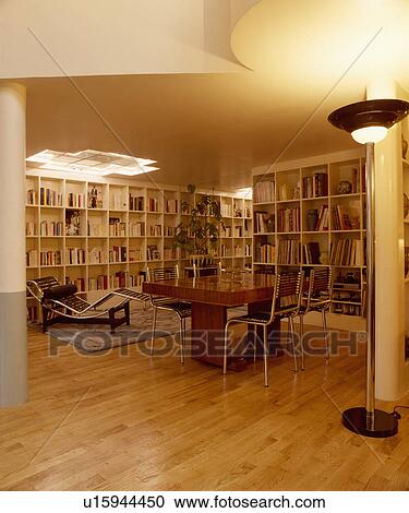 Le Corbusier chaiselongue in twenties style dining room with parquet floors and shelving on walls  View Large Photo Image Stock Image - Le Corbusier chaiselongue in twenties style dining room with parquet floors and shelving on walls . Fotosearch