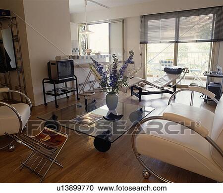 Leather and chrome furniture in modern living room with television View Large Photo Image Stock Image - Leather and chrome furniture in modern living room with television. Fotosearch