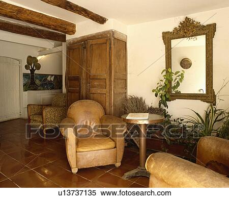 Leather armchairs in French country living room View Large Photo Image Stock Photography - Leather armchairs in French country living room. Fotosearch
