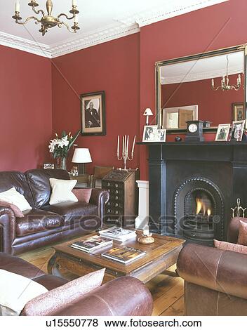 Stock Photo - Leather sofa in red living room. Fotosearch