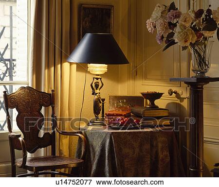 Lighted lamps on table in traditional living room View Large Photo Image Stock Photo - Lighted lamps on table in traditional living room. Fotosearch