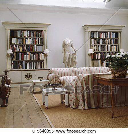 Stock Photography - Loosecovers on sofas in modern living room. Fotosearch